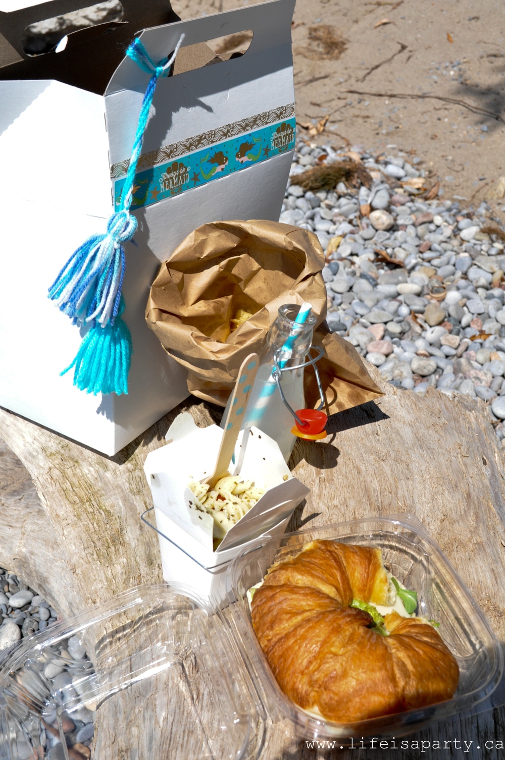 Mermaid Party Food: Inspiration for a Mermaid Beach Picnic, with a themed Mermaid Dessert Table full of mermaid treats like eatable driftwood, pearls, treasure, and coral.