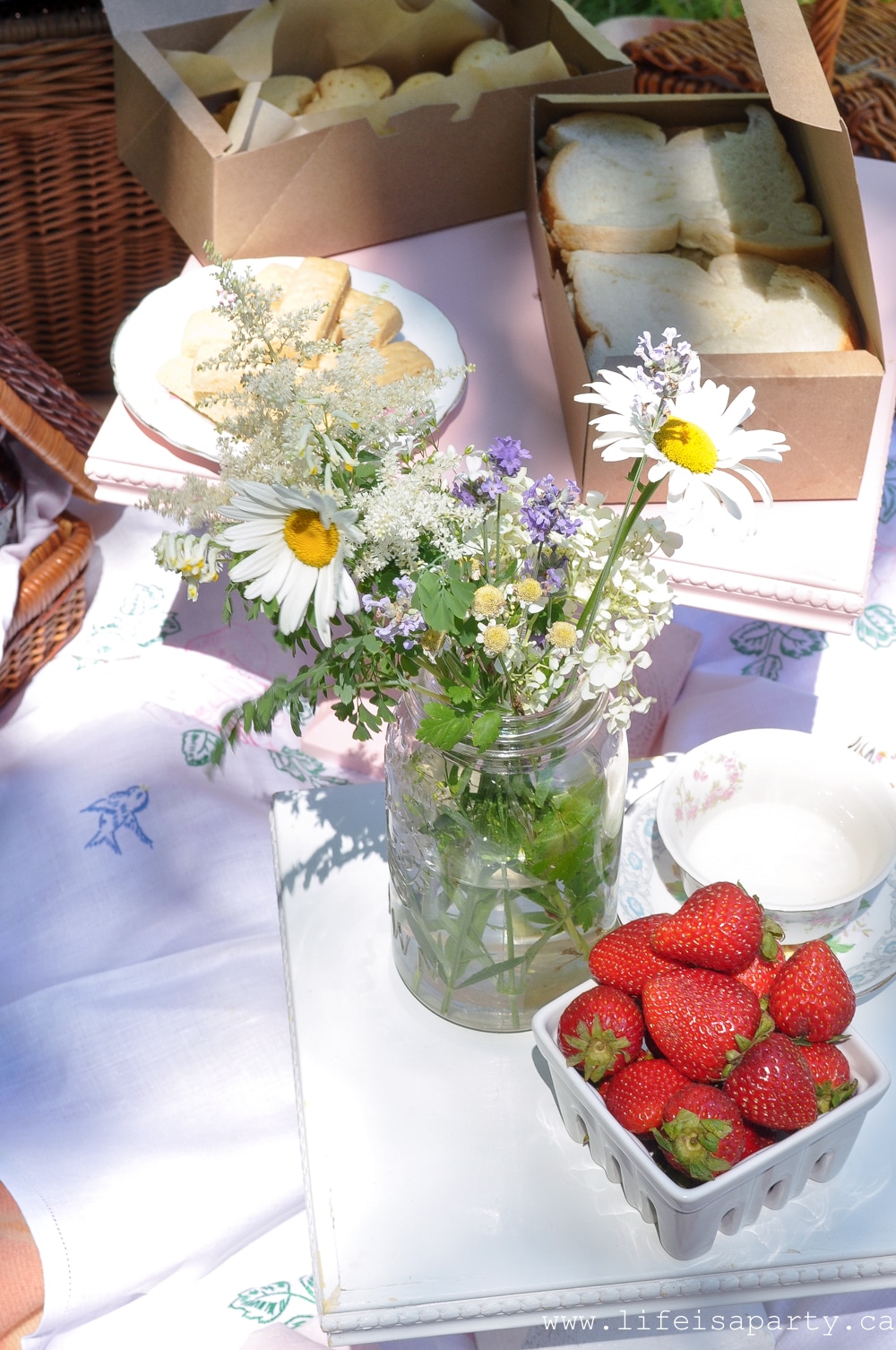 English inspired picnic includes tea sandwiches, home-made scotch eggs, scones and cream, shortbread, empire cookies, custard creams, vintage decor and lots and lots of tea.