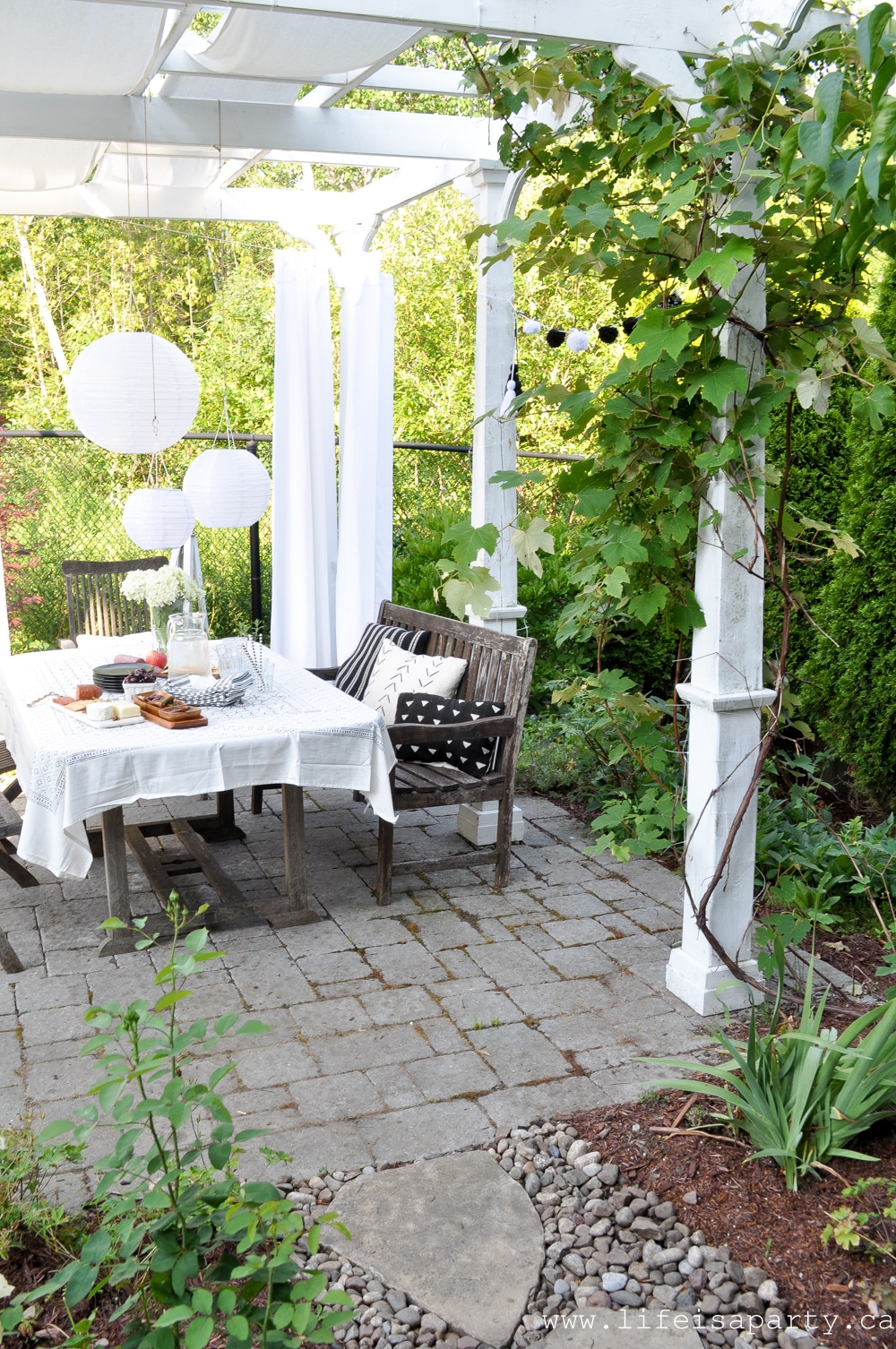 Black and White Garden -an old garden is refreshed with a new pea gravel seating area, and lots of black and white accessories and plants, including a garden of all white plants.
