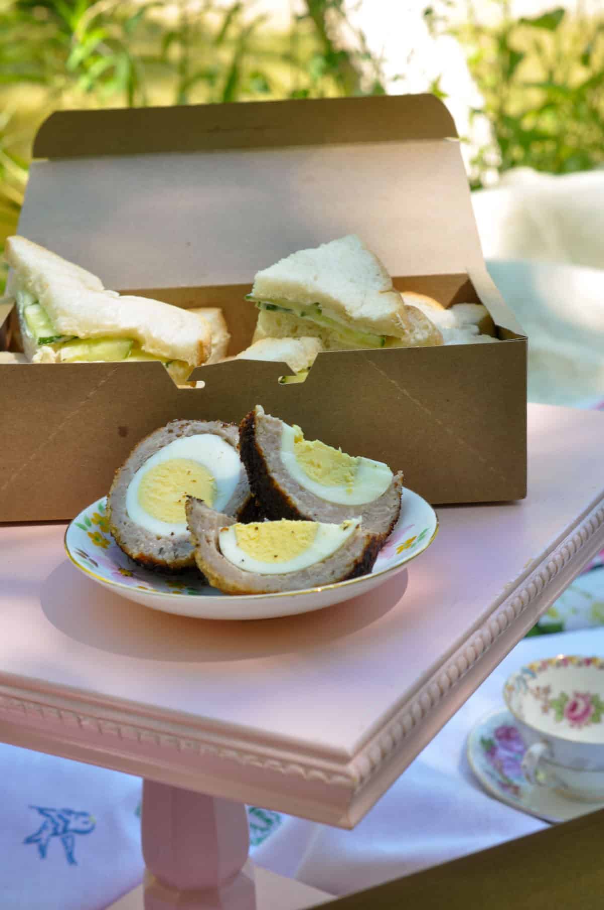 Tea sandwiches and scotch egg for a tea party picnic.