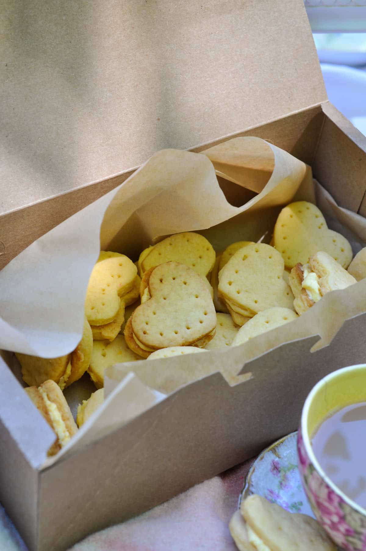 Heart shaped custard cream cookies for a tea party picnic.