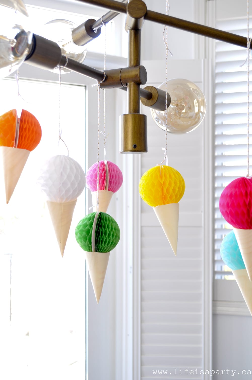 Ice Cream Themed Party Decorations: easy, DIY, inexpensive and colourful ice cream decoations like our ice cream cone dessert table backdrop, and ice cream cone bunting.