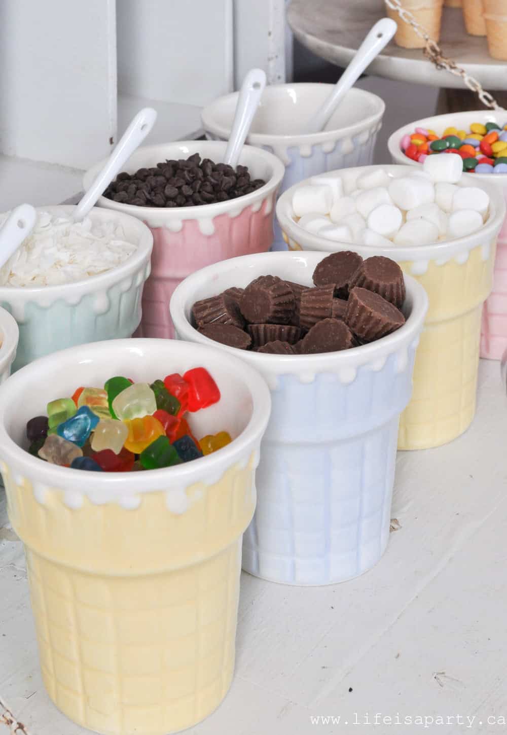 Ice cream buffet toppings of gummies, mini marshmallows, chocolates and more.