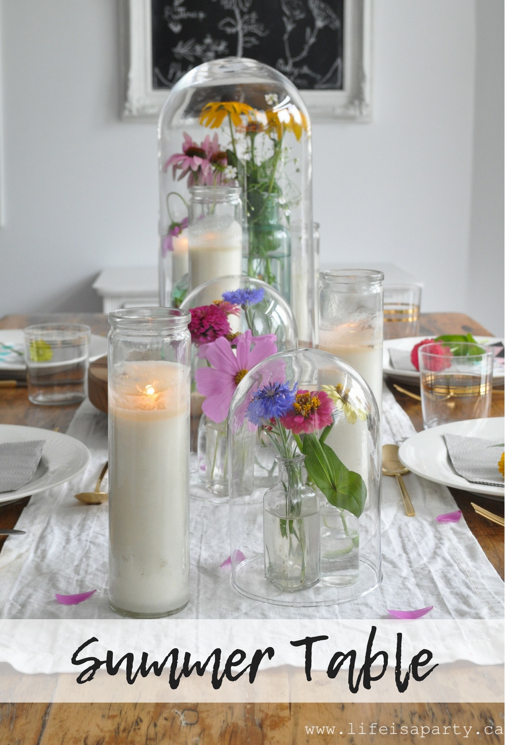 Summer Tablescape -garden flowers in vintage bottles under glass cloches create a simple, easy summer time table for entertaining.