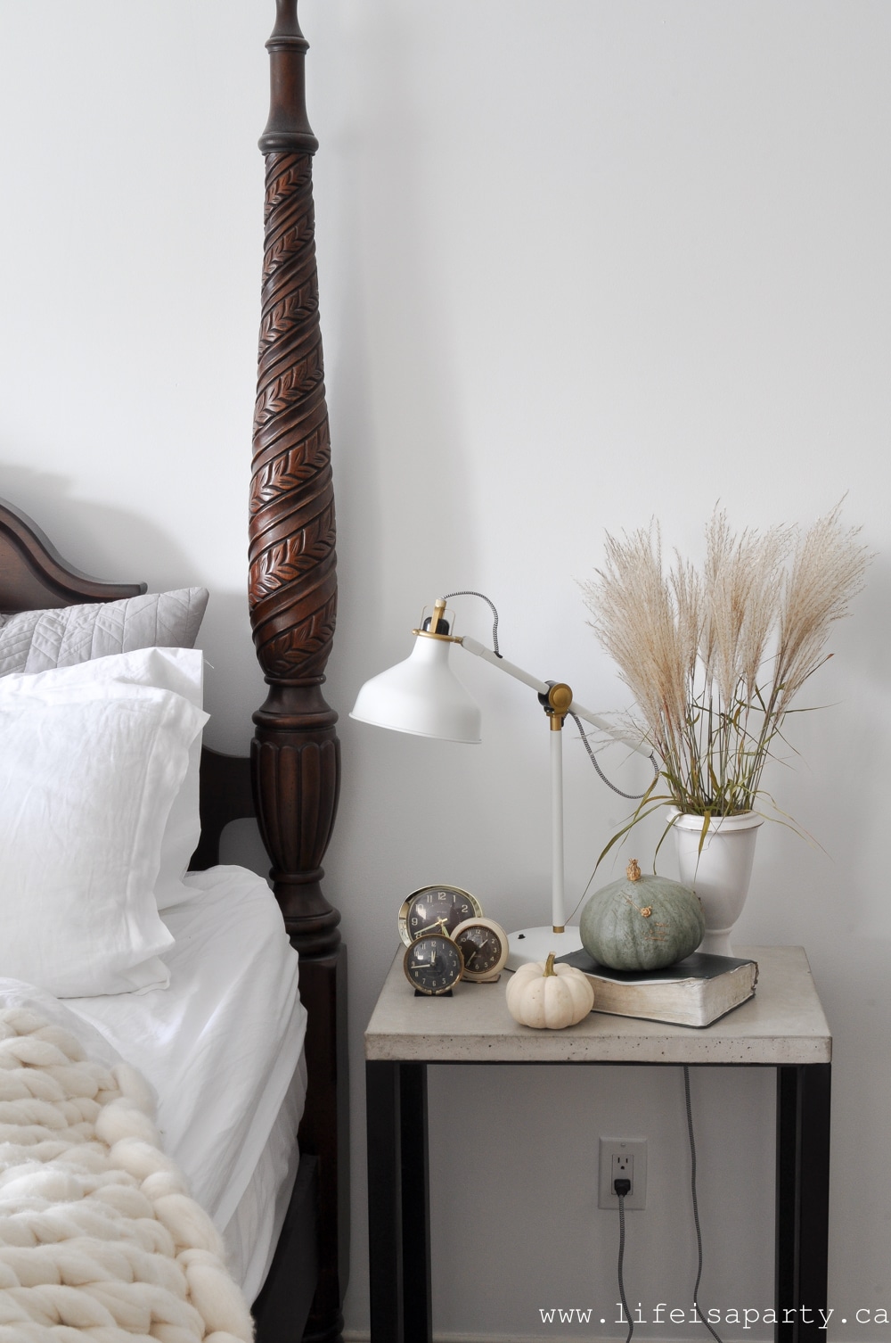Cozy Fall Bedroom: 5 simple ways to make your bedroom cozy for fall, like candles, layers, books, natural elements, and neutral decor.