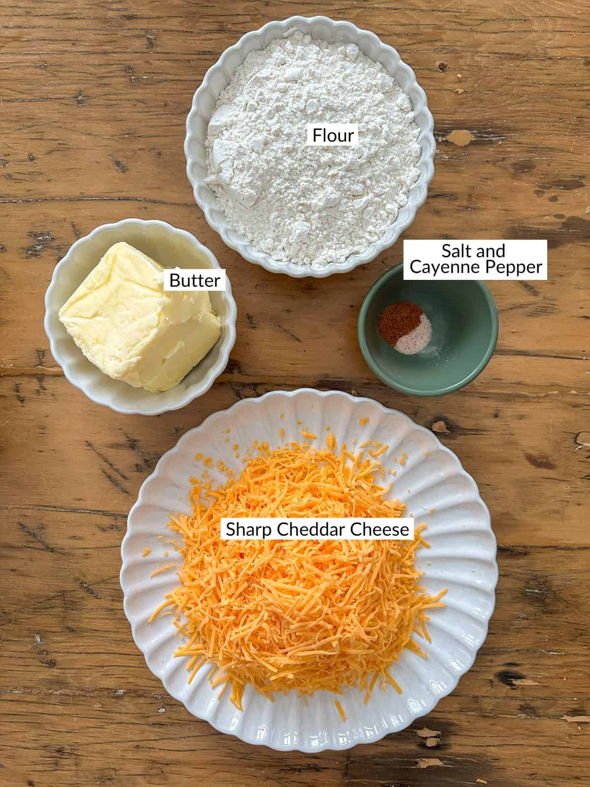 Cheese straw ingredients on a wood table.