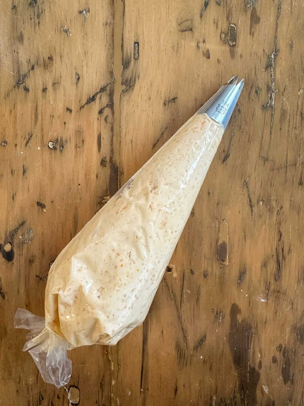 Cheese straw dough in a piping bag.