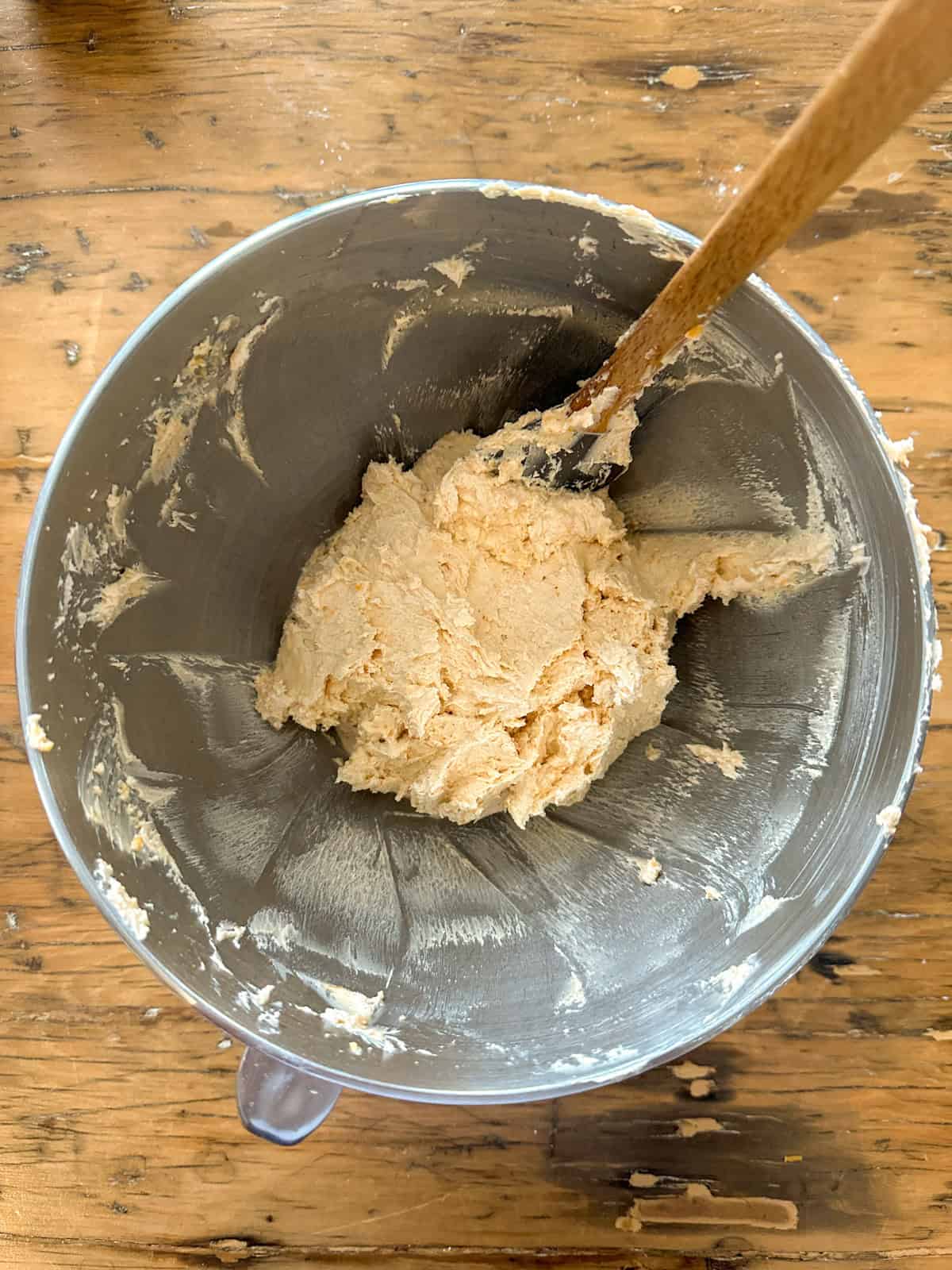 Dough for homemade cheese straws in a stand mixer bowl.