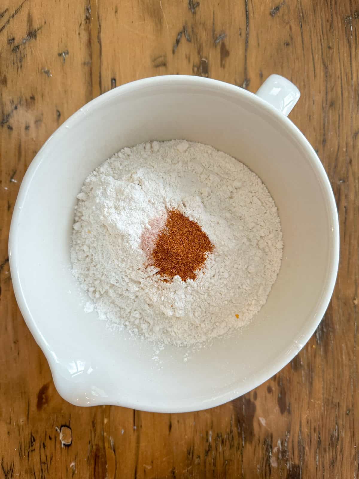 Dry ingredients for cheese straws in a mixing bowl.