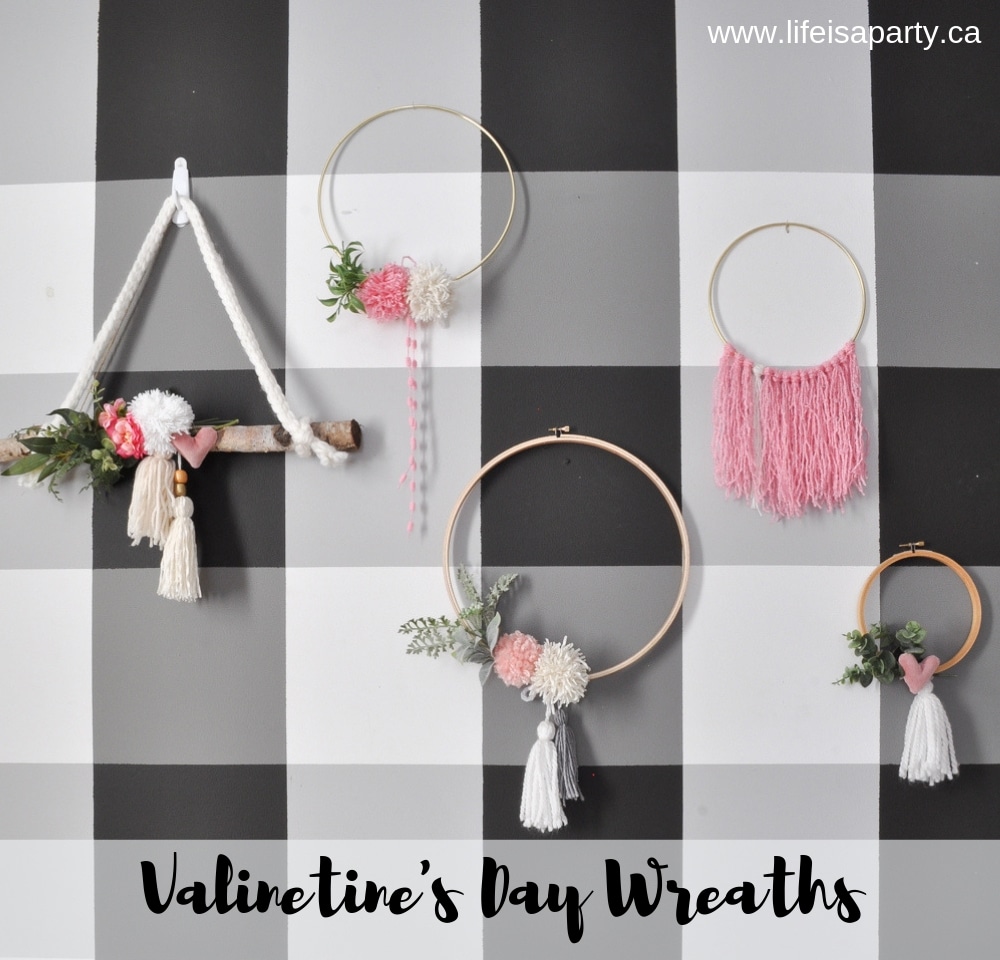 Valentine's Day Wreath Ideas: wood embroidery hoops, brass rings and birch, decorated with pink pom poms, tassels, greens, and velvet hearts.