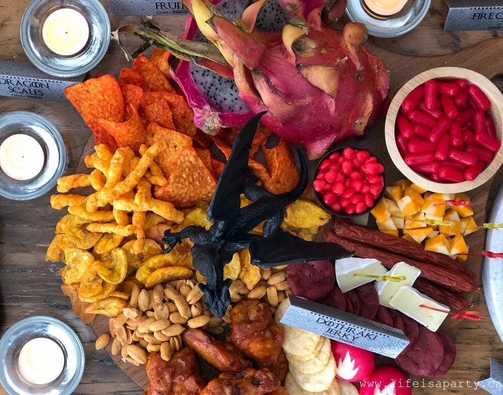 spicy themed snack board with fiery foods and a dragon centre piece