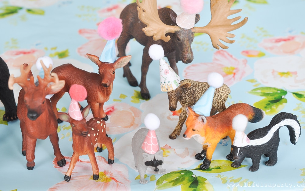 toy animals in party hats