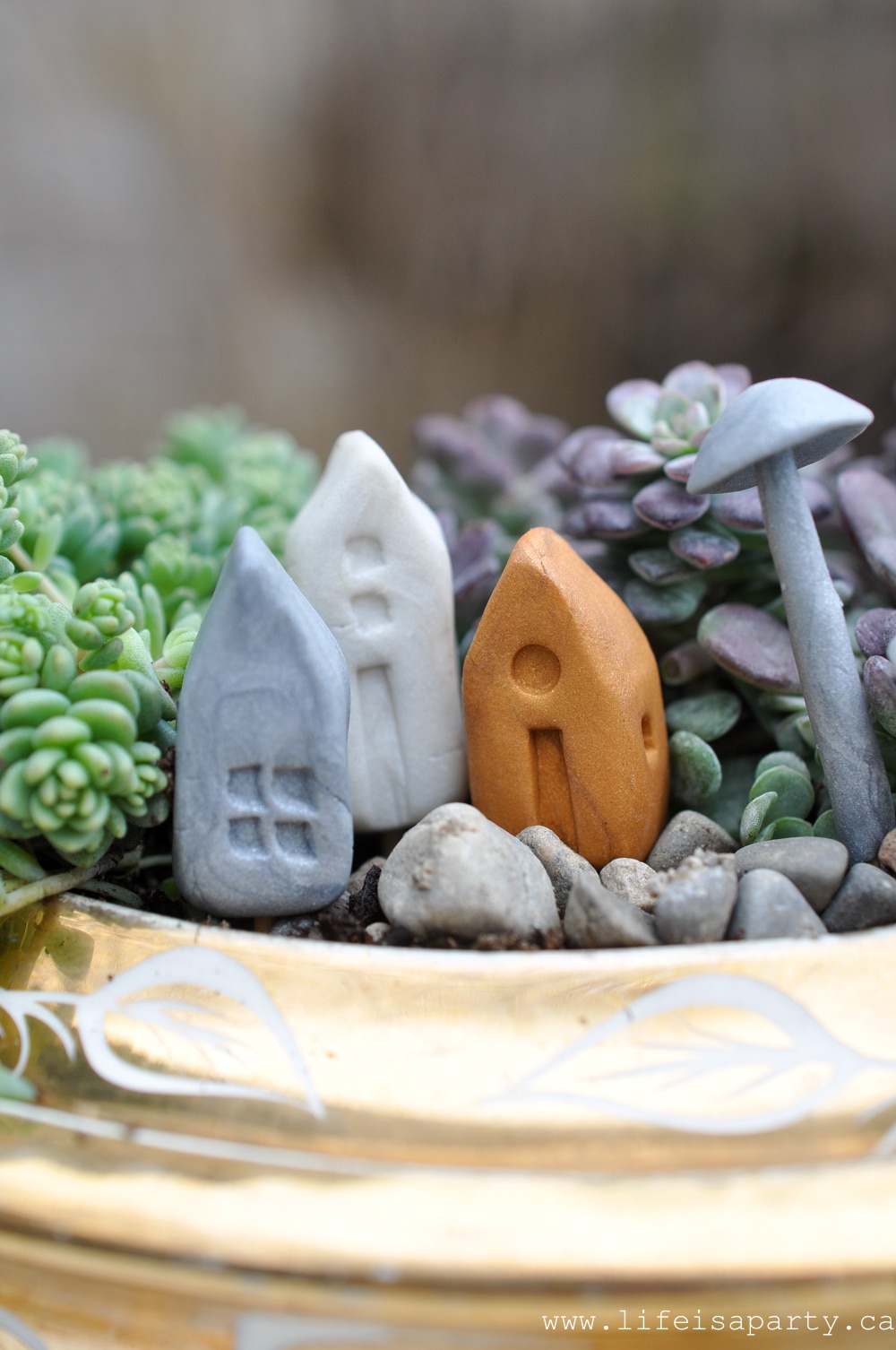 polymer clay fairy houses and mushrooms.