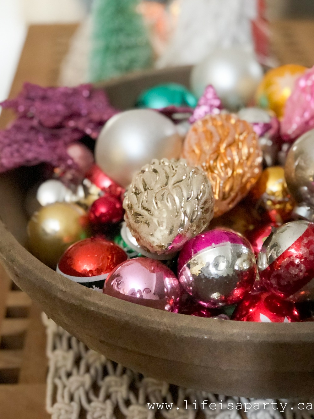 vintage Christmas ornaments in a wood bowl