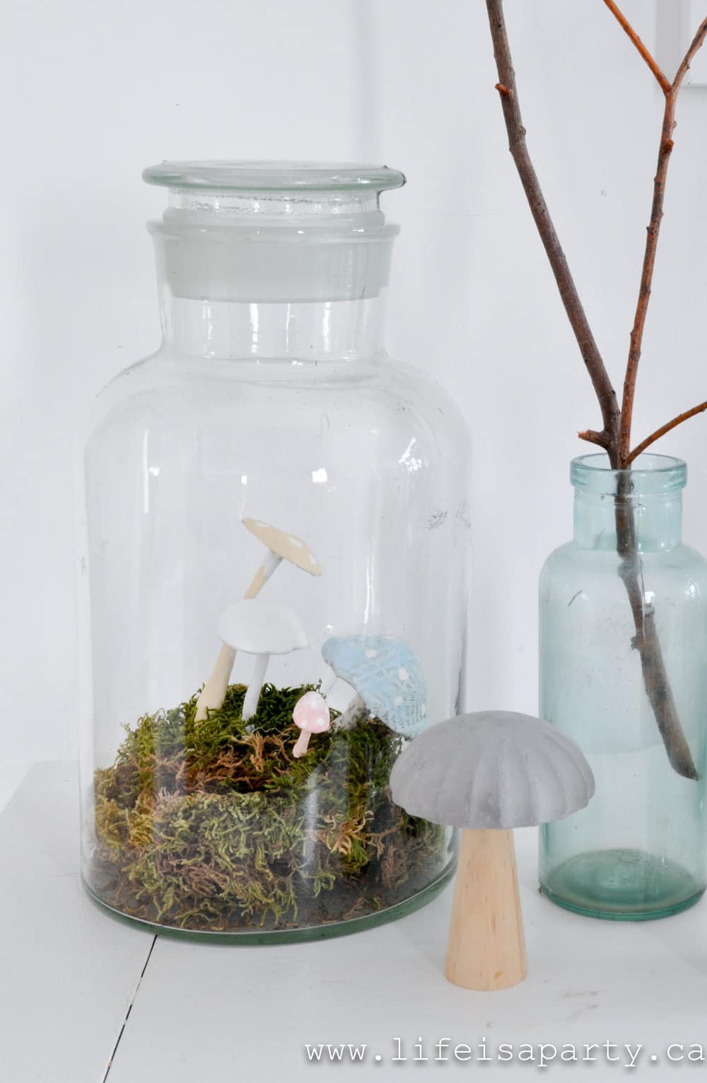 DIY terrarium with faux mushrooms and moss