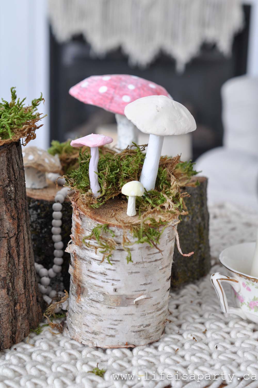 dit faux mushrooms on a log with moss centrepiece