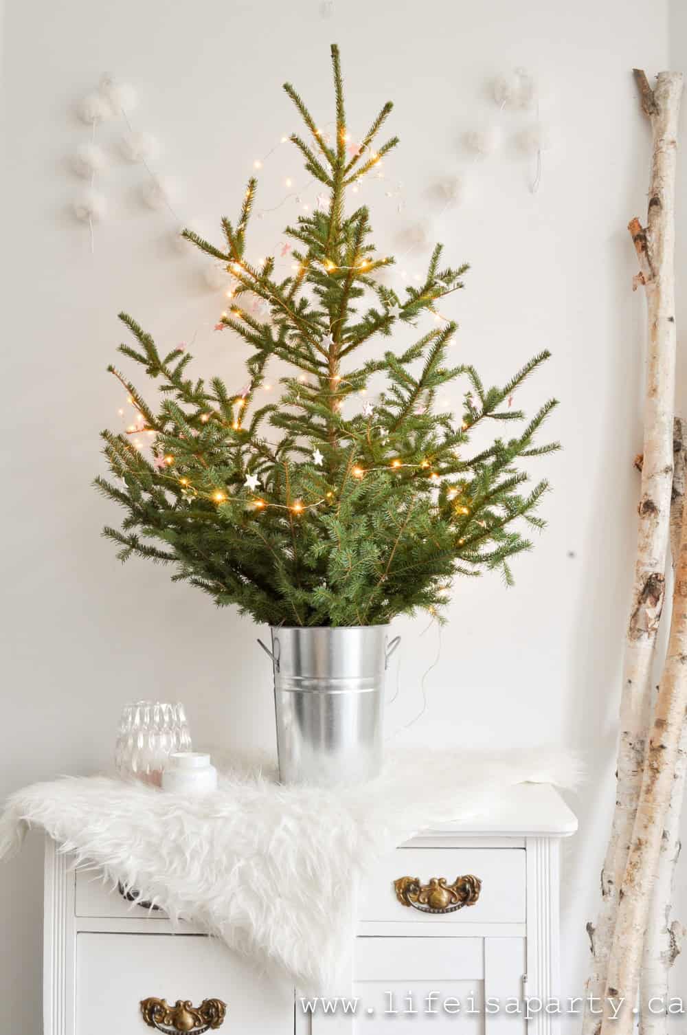 mini Christmas tree in a galvanized bucket