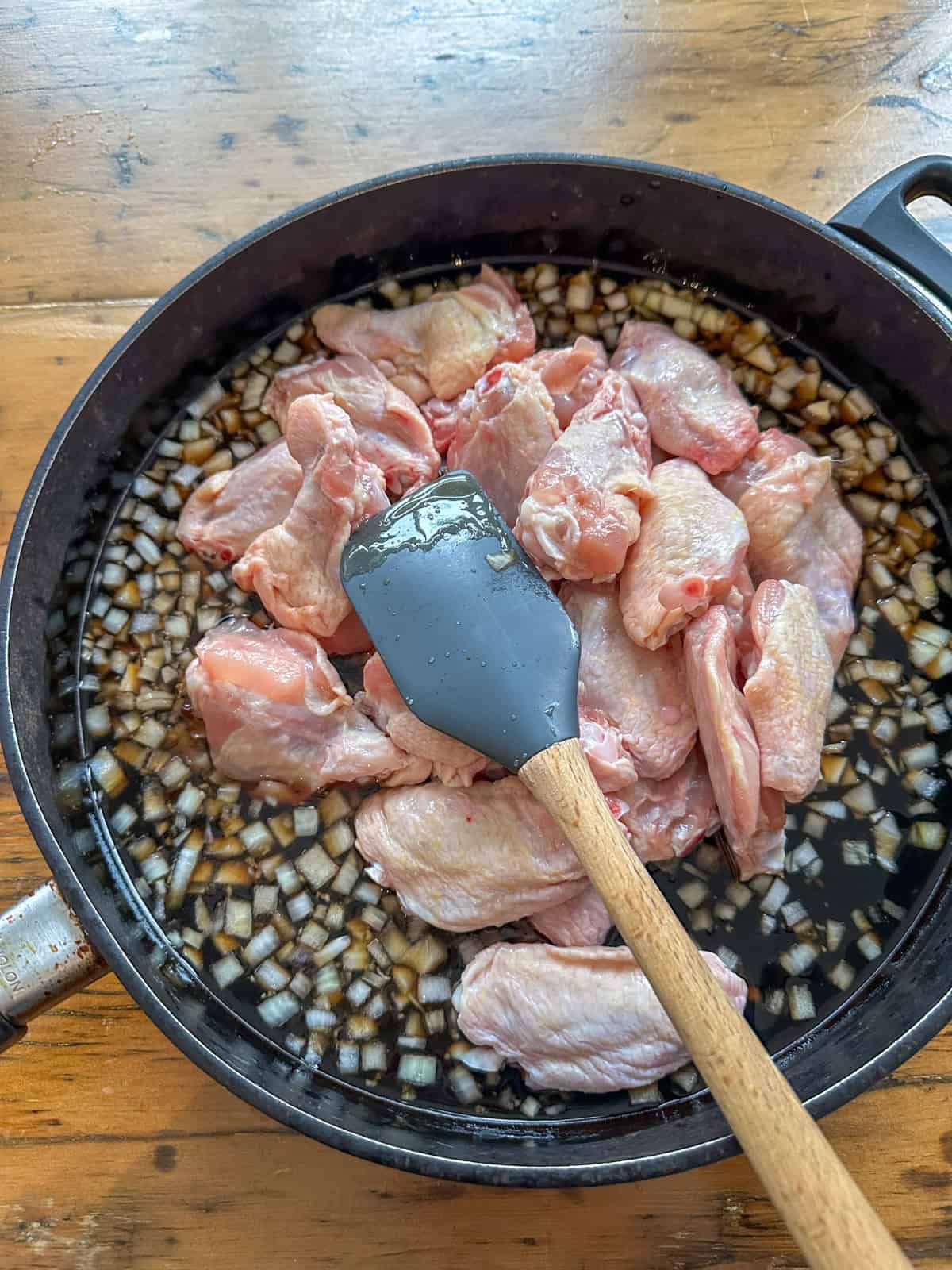 Honey garlic chicken wing ingredients in a large skillet, before cooking.