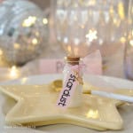 Small glass bottle filled wth glitter and labeled stardust.