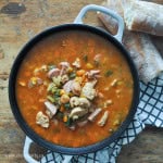 Chicken sausage and shrimp gumbo in a cast-iron pot.