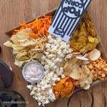 Chip charcuterie board with different chips, and salty snacks.
