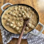 Easy recipe for Swedish meatball sauce with meatballs in a skillet.