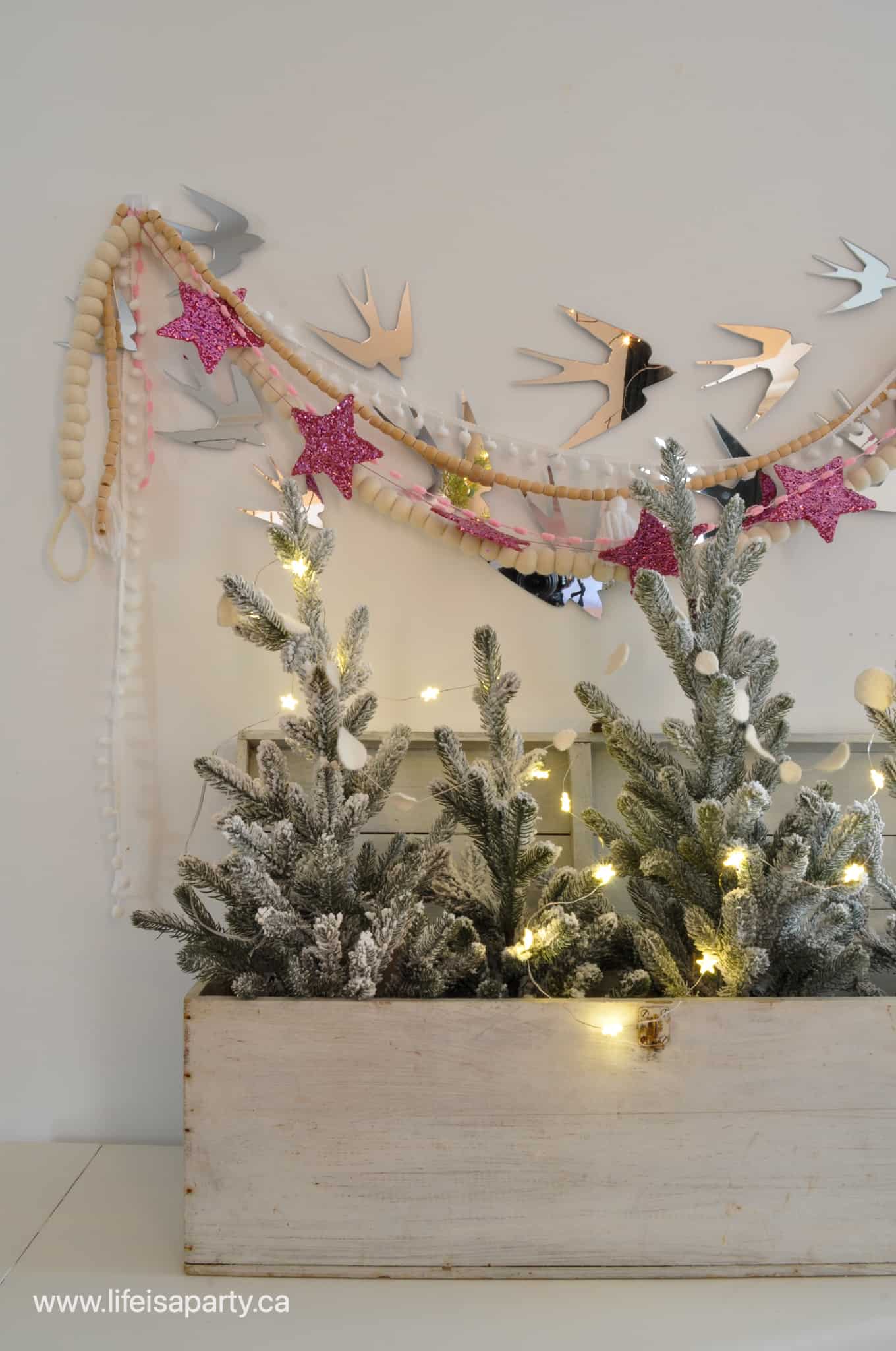 mini Christmas trees in a vintage white box