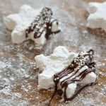 Homemade marshmallow mug toppers with chocolate drizzle.