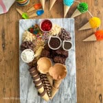 Ice cream charcuterie dessert board in the shape of an ice cream cone.