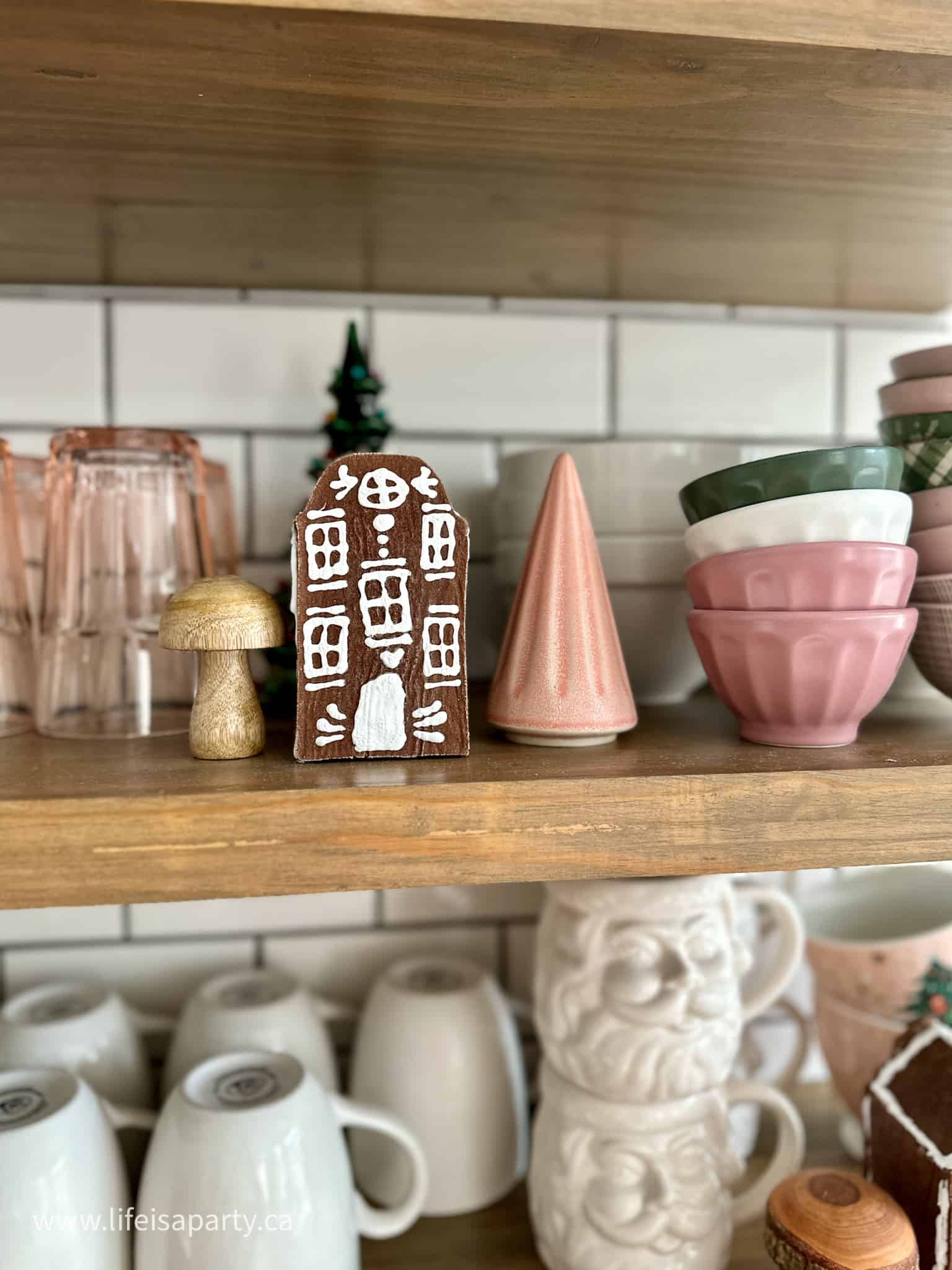 gingerbread house on kitchen shelves
