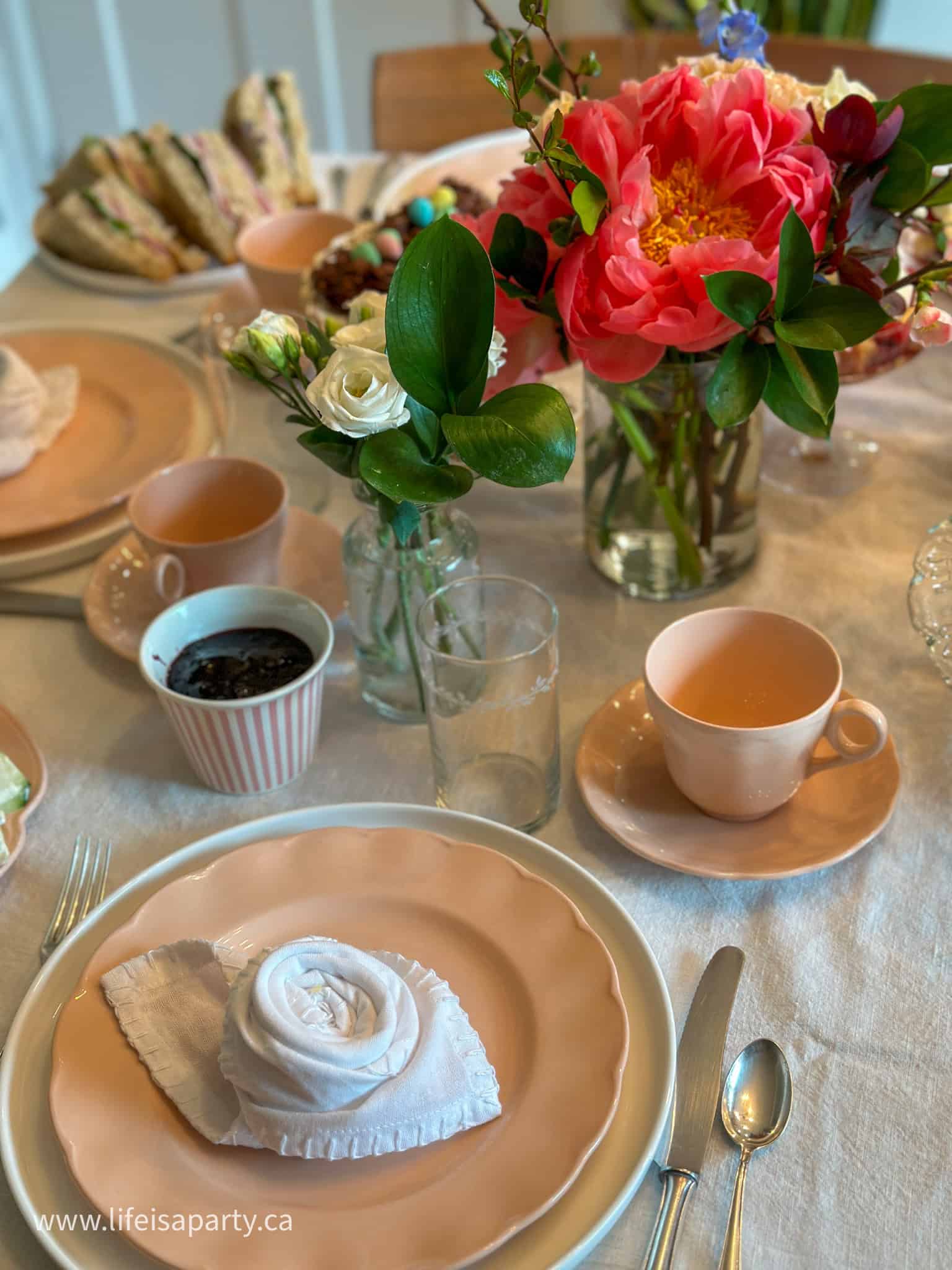 tea party place setting with flower napkin