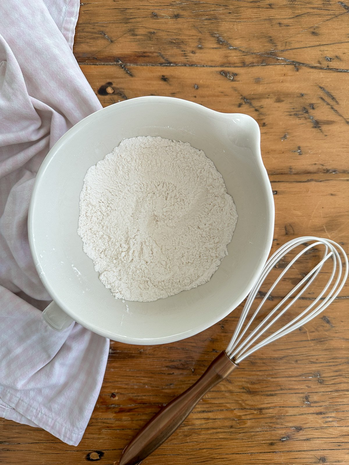 Dry ingredients for small batch pancakes for two, in a mixing bowl.