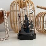 DIY Cricut Halloween Cloche: use dollar store materials to make this haunted house, and graveyard silhouette cloche for Halloween.