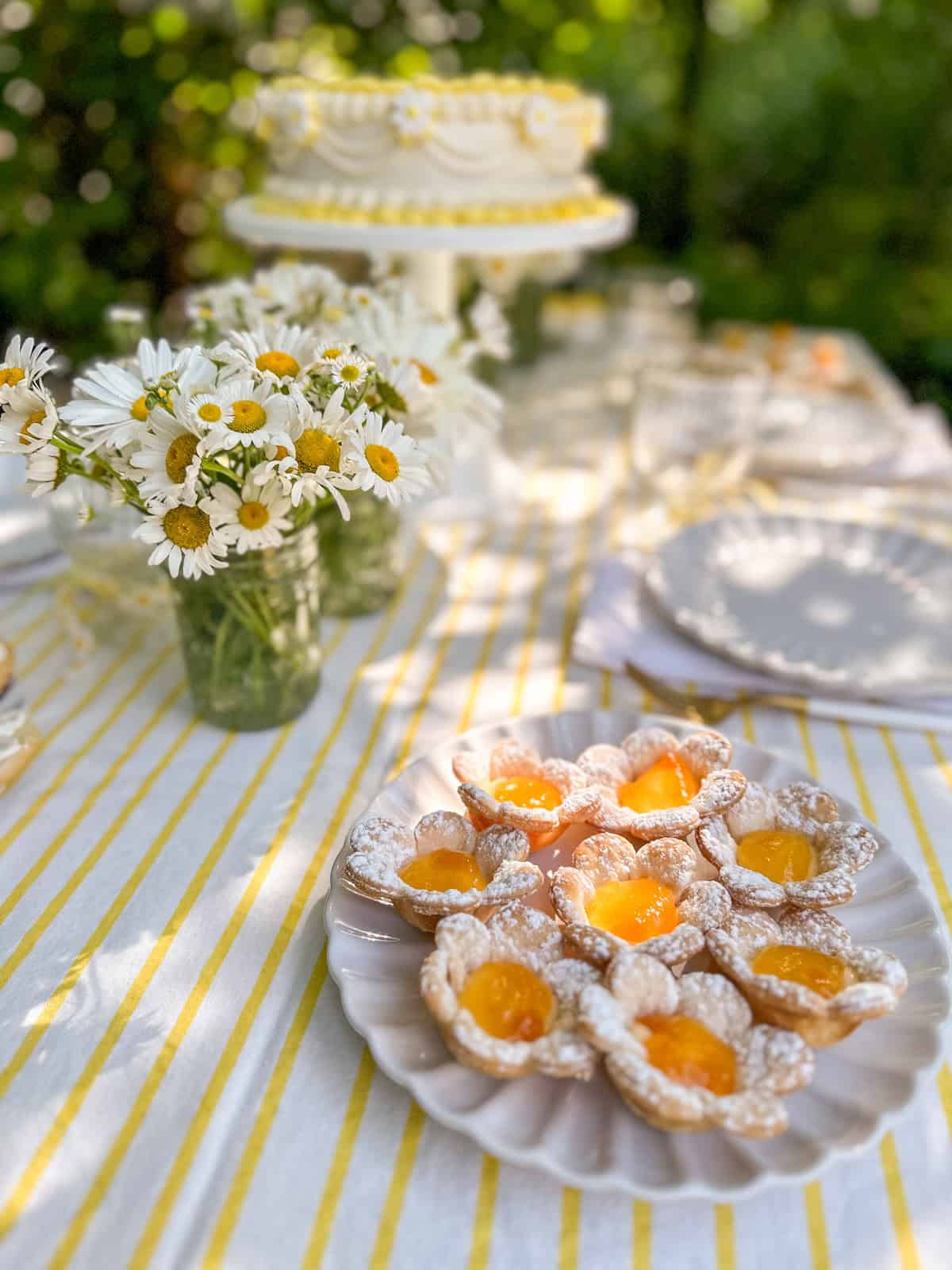 Daisy tarts that are filled with custard and apricot jam.