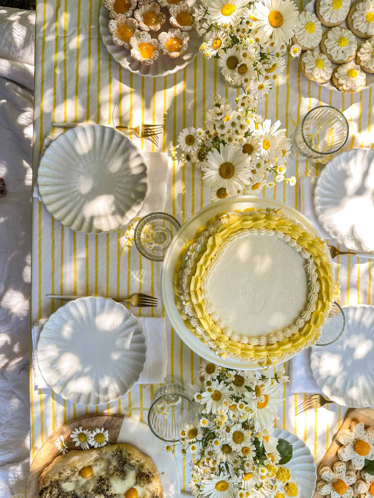 Daisy themed picnic party with daisy inspired food and decor.