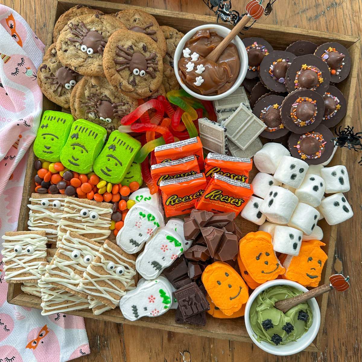 Halloween smores board with Halloween cookies, marshmallows, chocolate and more!