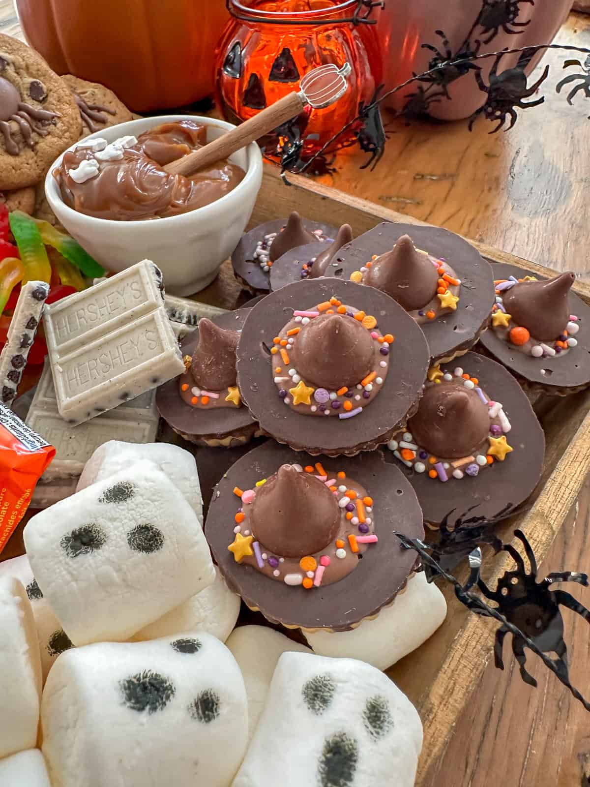 Halloween witch hat cookies on a smores tray.