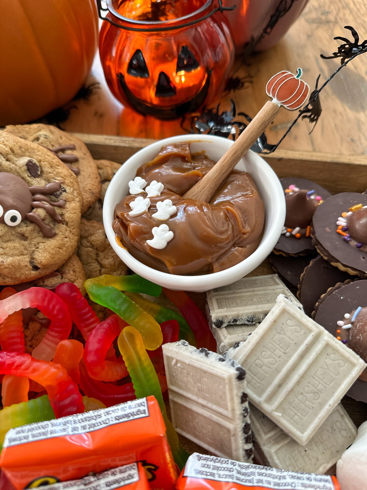 Bowl of dulce de leche on a Halloween smores board.