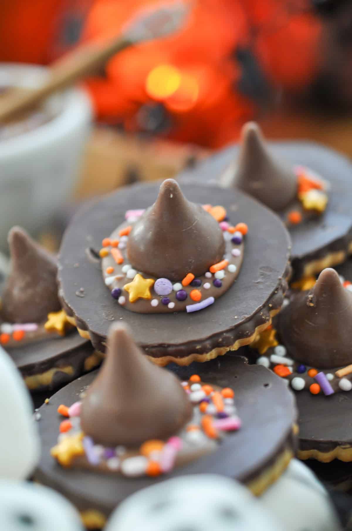 Witch hat cookies made with round chocolate cookies, and Hershey's Kisses.