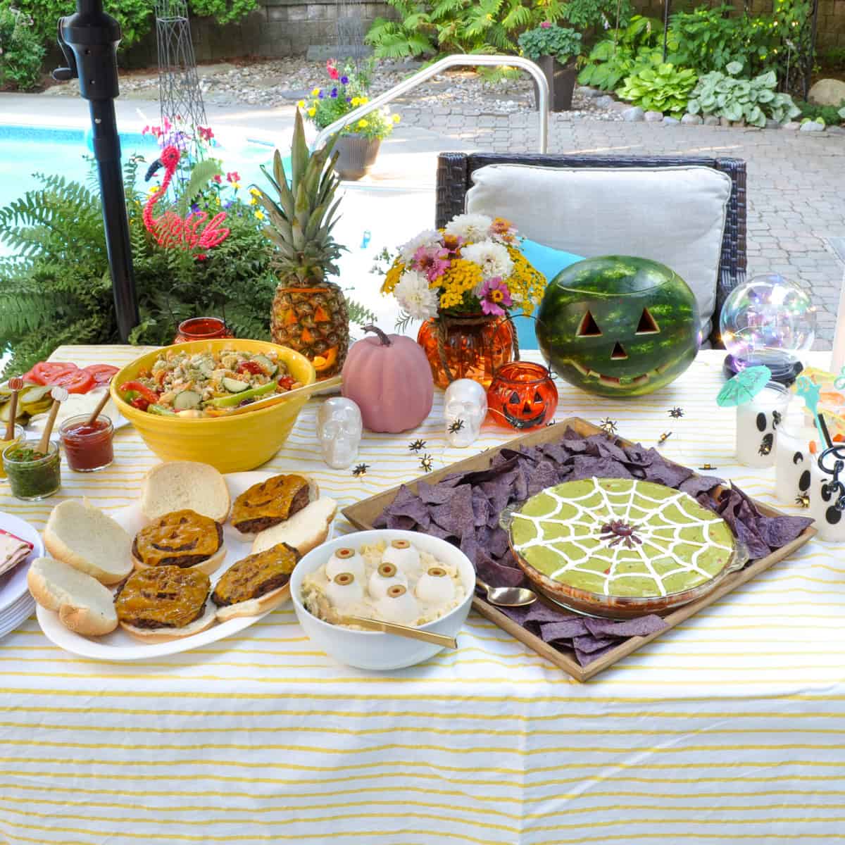 Summerween party table with themed food.