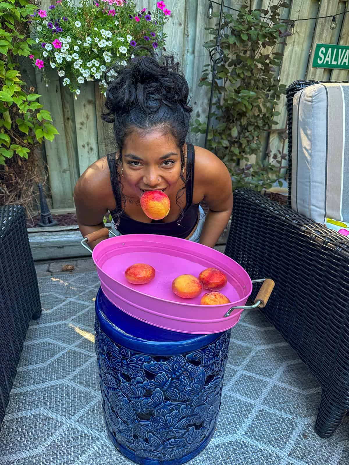 Bobbing for peaches at a summerween party.