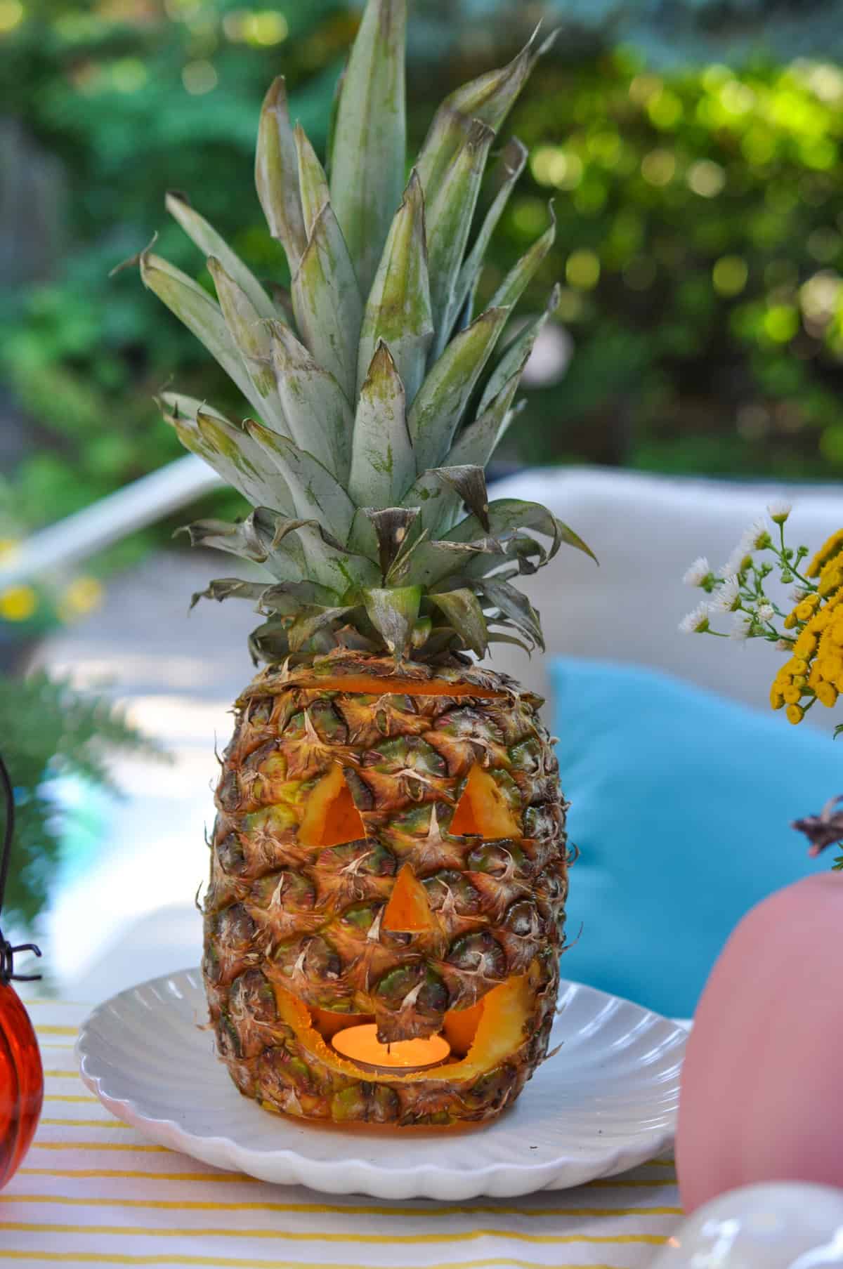 Pineapple jack-o-lantern at a summerweeen party.
