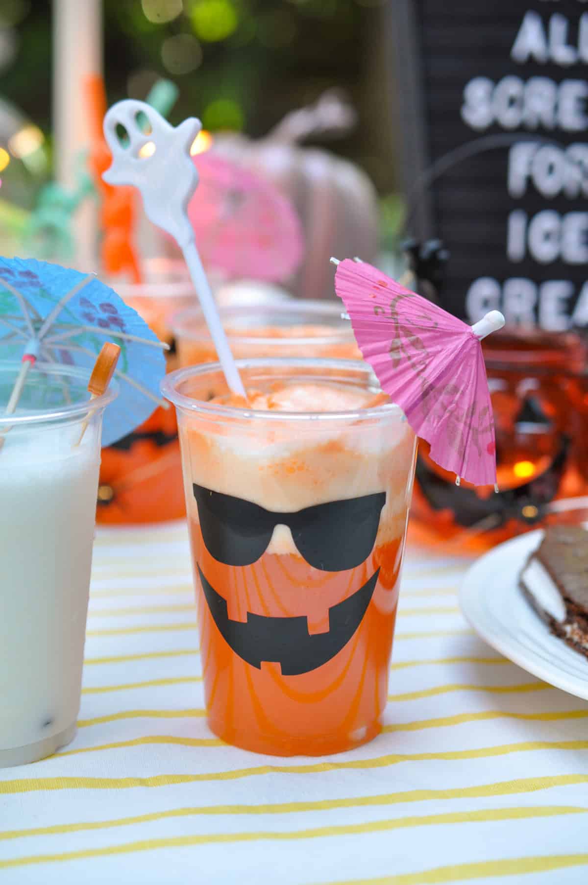 Halloween orange pop float in a pumpkin cup.