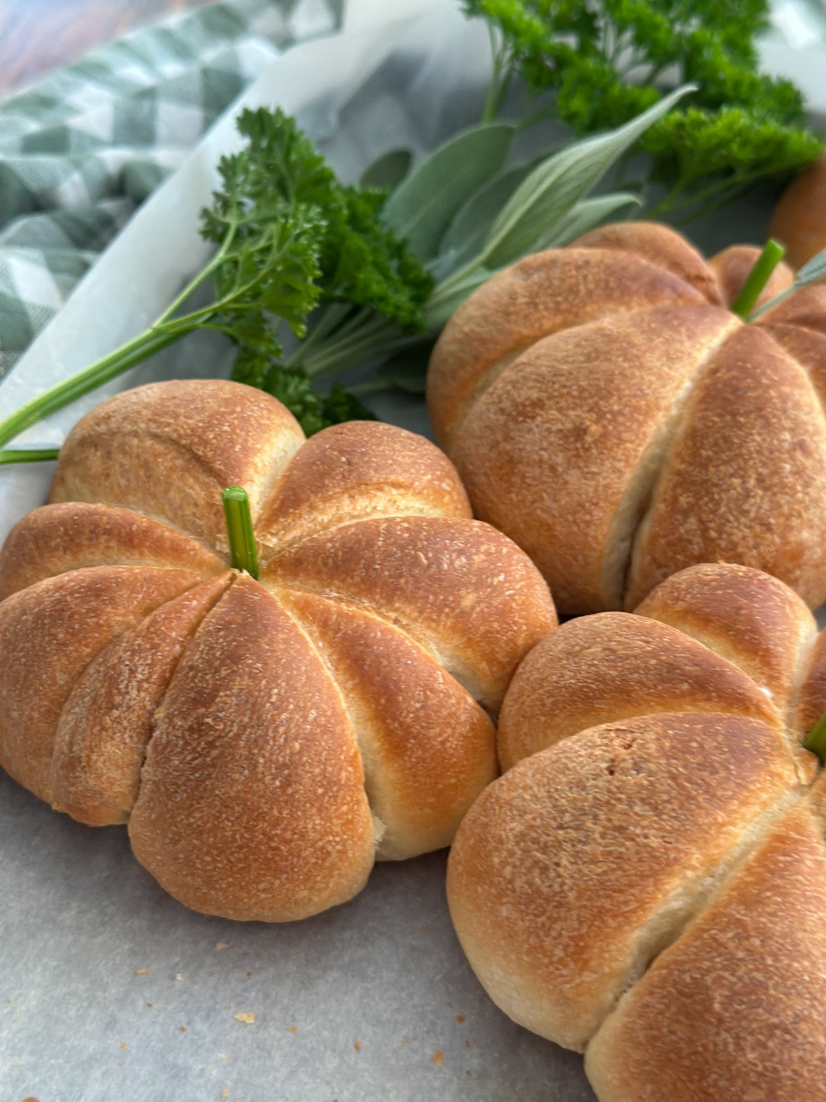 Pumpkin shaped dinner roll with an herb stem.