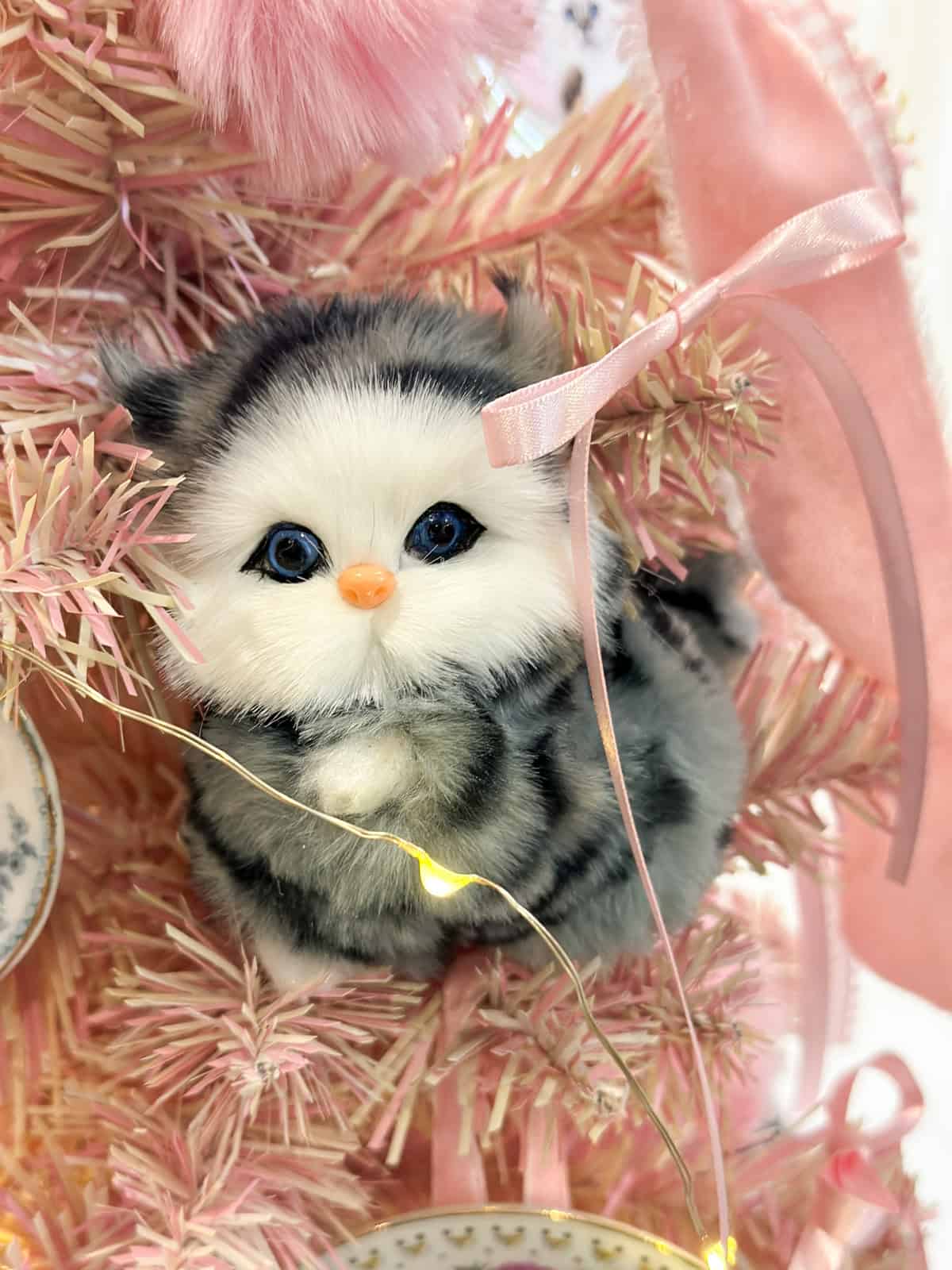 Cat Christmas ornament on a pink Dolores Umbridge-inspired Harry Potter Christmas tree.