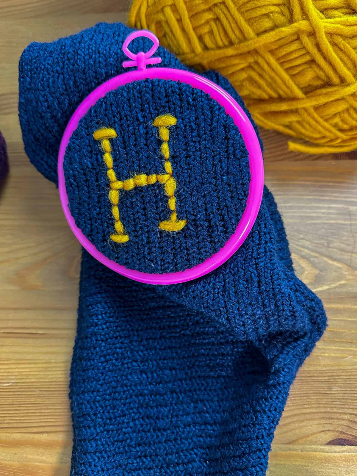 DIY Harry Potter stocking  modeled on the sweaters Mrs. Weasley knits for Christmas, with an "H" for Harry stitched on it.
