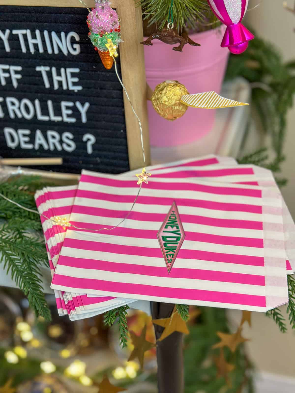 Honeydukes candy bags with logo stickers for Harry Potter Christmas candy cart.