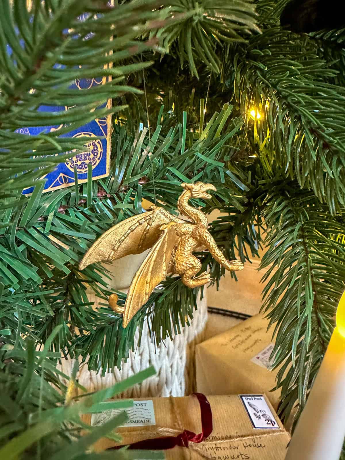 DIY gold dragon Chrismas oranment hanging on a Harry Potter themed tree.