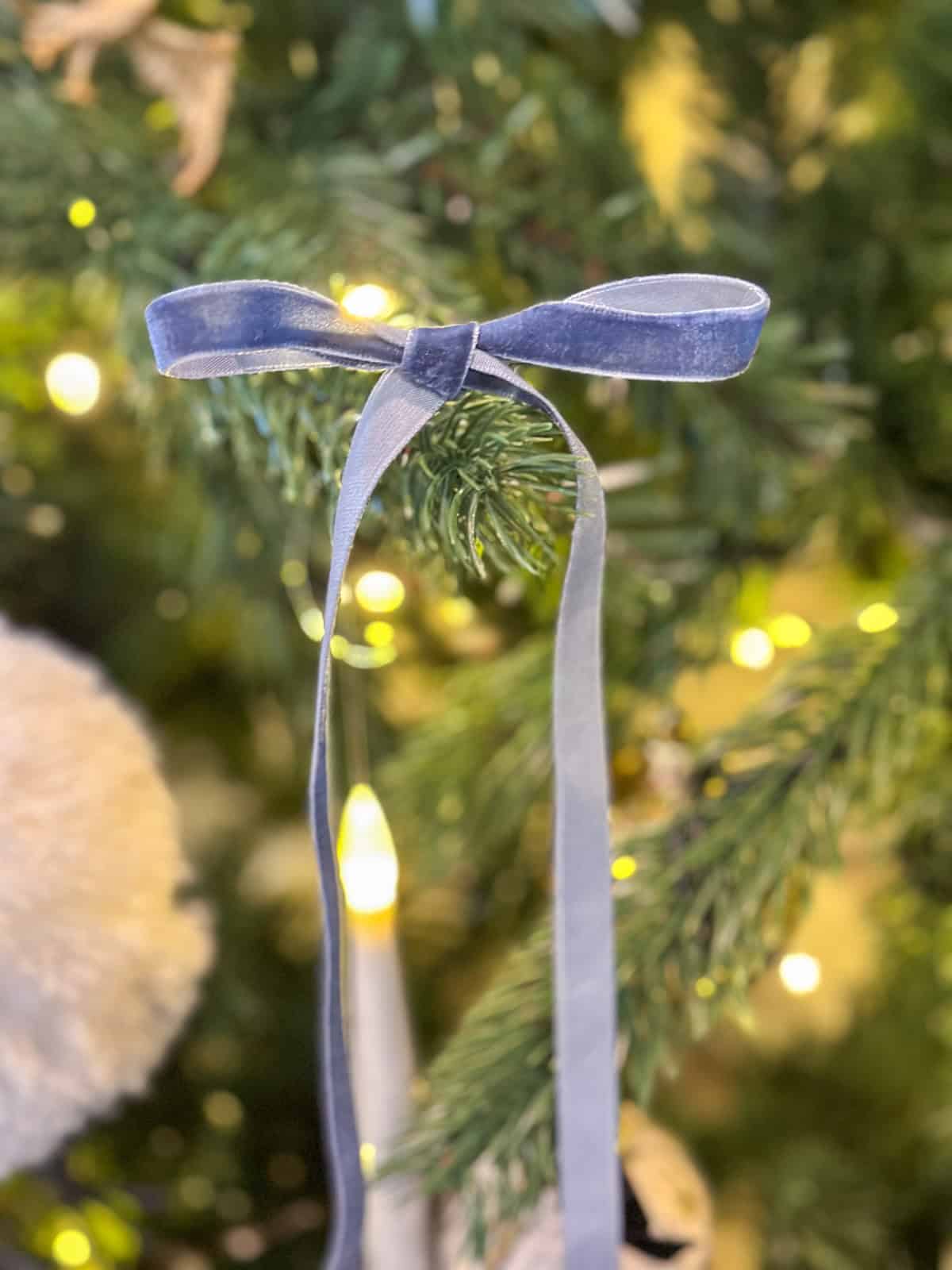 Blue velvet ribbon bow representing Ravenclaw house colors on Harry Potter themed Christmas tree.