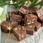 Easy chocolate walnut fudge made in the microwave with sweetened condensed milk, cut into squares.